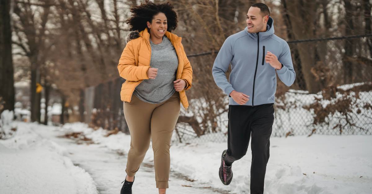 Running smiling illustrating exercise makes you happy mentally.