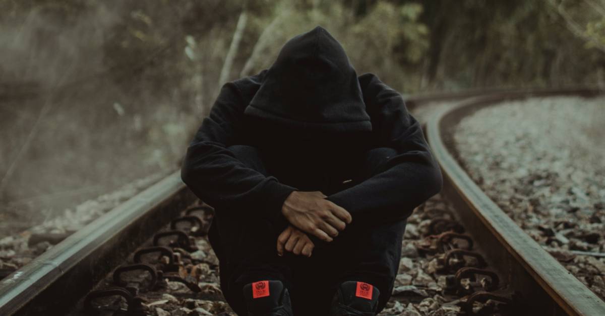 Man head down FB Mans head down to illustrate disappointment